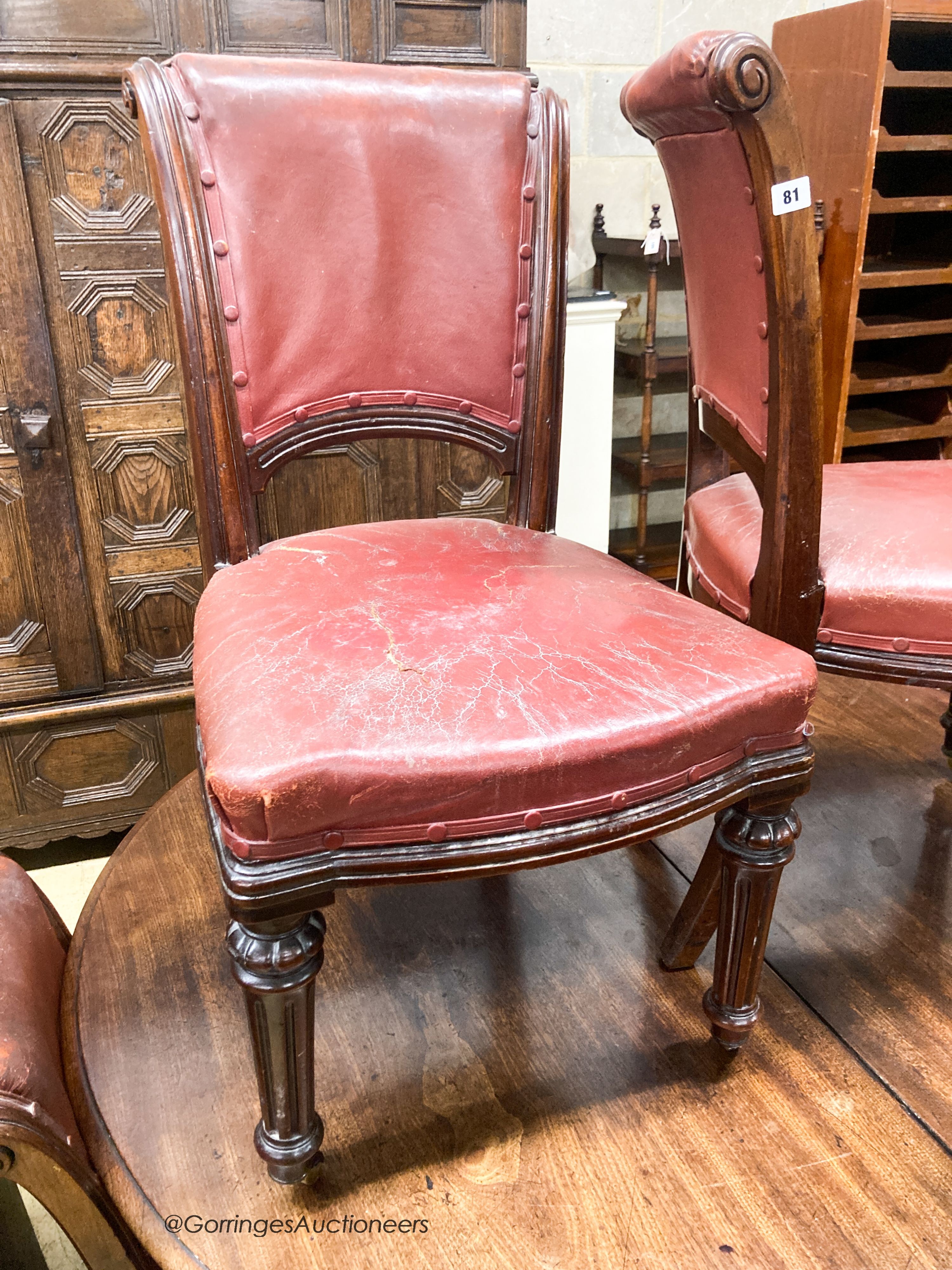 A set of six Victorian leather and mahogany dining chairs